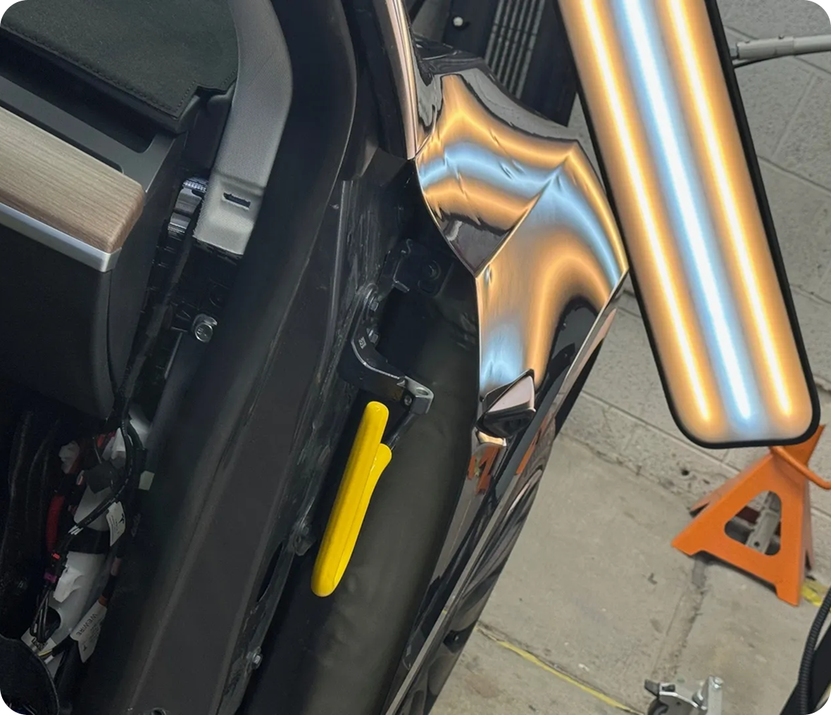 Car door repair with reflection lights.