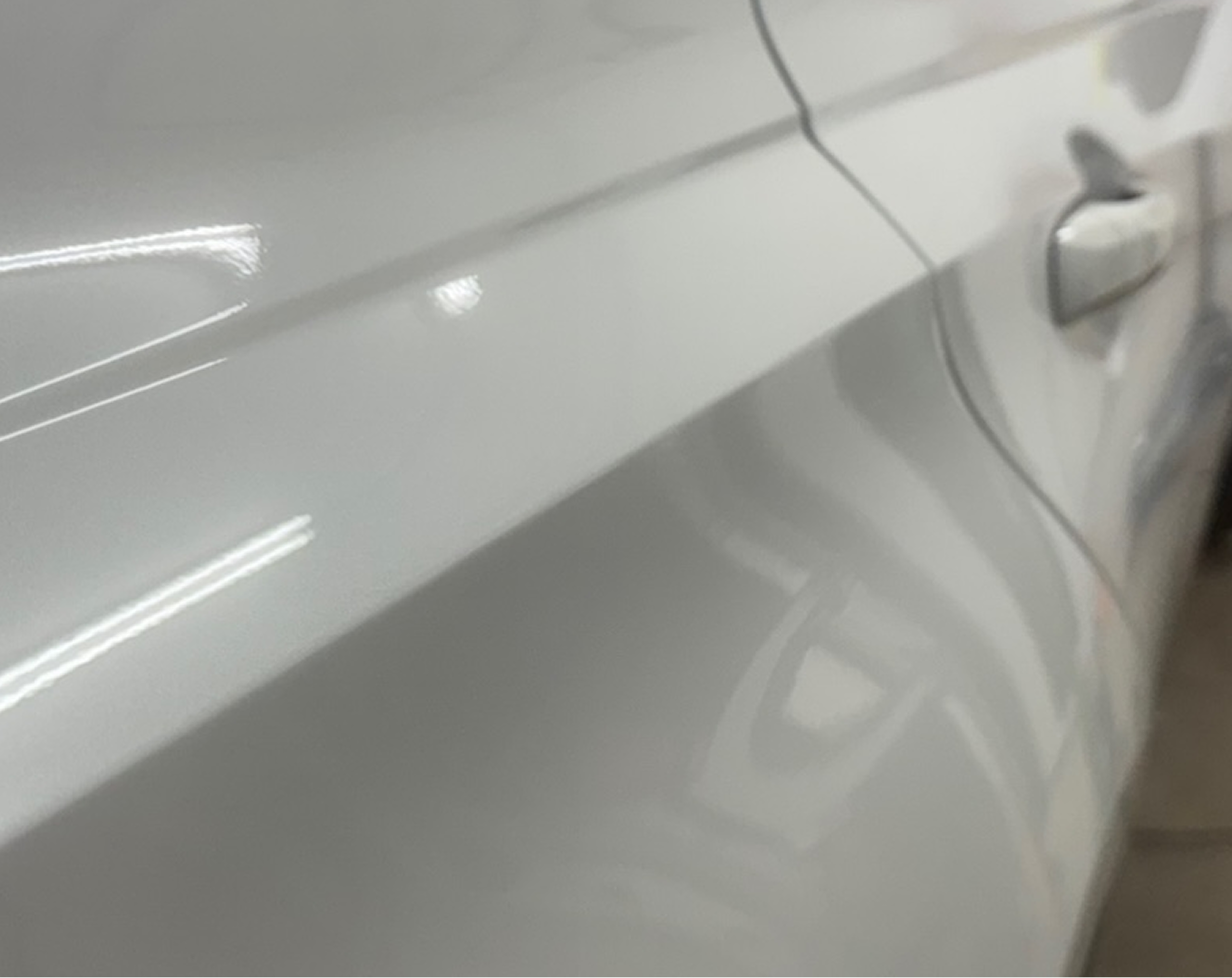 Shiny white car surface detail